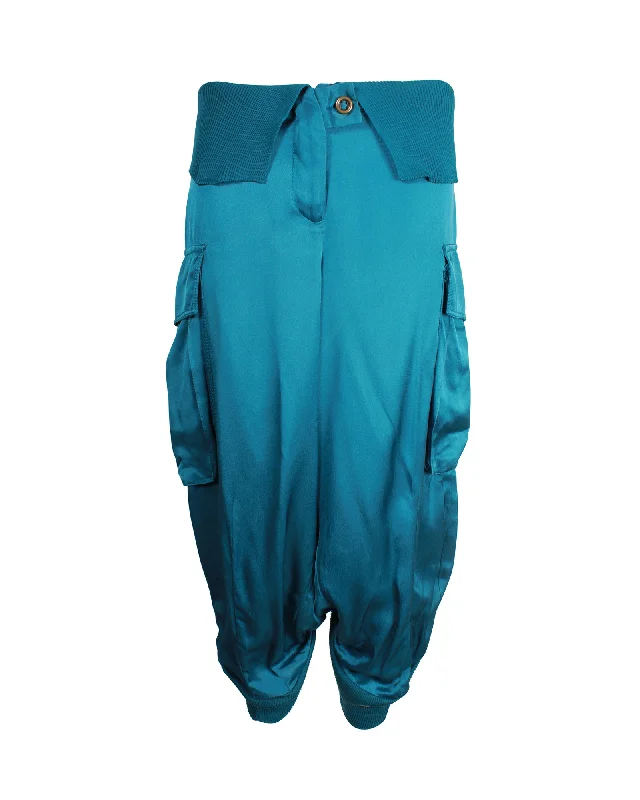 Booty-lifting trousers – Trousers designed with specific stitching or structure to enhance the shape of the rear.Booty-lifting trousers – Trousers designed with specific stitching or structure to enhance the shape of the rear.Alexander McQueen Vintage Balloon Pants in Teal Silk Booty-lifting trousers – Trousers designed with specific stitching or structure to enhance the shape of the rear.Booty-lifting trousers – Trousers designed with specific stitching or structure to enhance the shape of the rear.Alexander McQueen Vintage Balloon Pants in Teal Silk